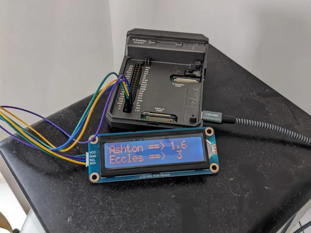 Picture of a Raspberry Pi 4 connected to a 16x2 LCD showing tram times